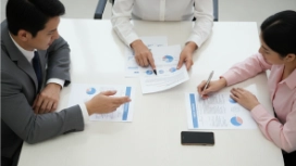 Professionals collaborating in a meeting, illustrating team motivation, employee engagement and successful teamwork strategies