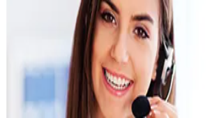 A smiling telemarketing representative wearing a headset speaks into a microphone, demonstrating communication and sales outreach skills in telemarketing training.