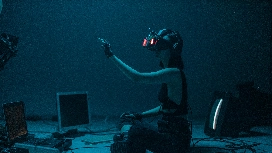 Beginner coding an AI model in TensorFlow on a laptop screen, representing OHSC’s free TensorFlow for Beginners course.