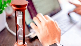 Manager organising schedules and priorities using effective workplace time management and efficiency techniques