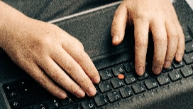 Learner practising on a keyboard, improving speed and accuracy in typing training for beginners and how to become faster at typing