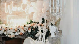 Elegant wedding venue decorated with florals, candles and soft lighting, representing design and layout skills taught in wedding venue planning courses.