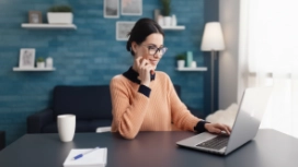 Professional working remotely with a laptop, illustrating work life balance strategies and healthy workplace habits