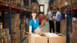 Professional employee working in a warehouse, illustrating workplace professionalism, responsibility and professional skills