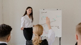 Professionals collaborating in an office while developing workplace skills plans and demonstrating professionalism in the workplace